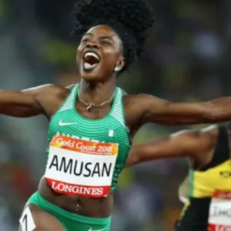 Tobi Amusan celebrating in Nigeria kit