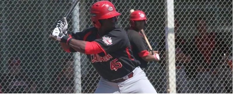 A batter in red at the plate