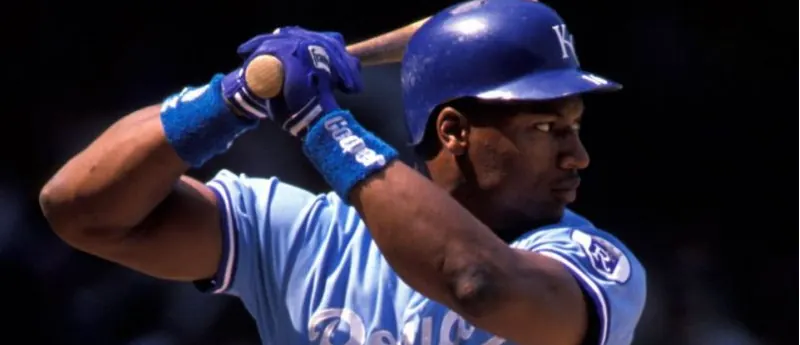 A batter in a blue uniform