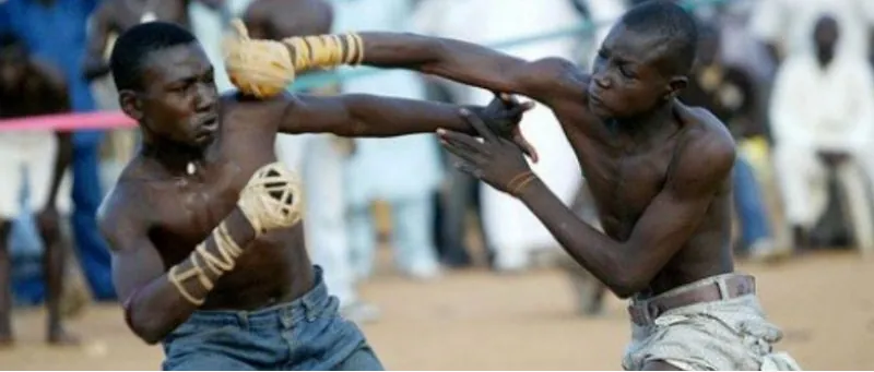 Two boxers in a traditional Dambe bout