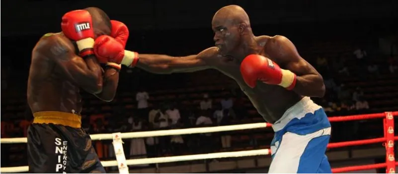 A Nigerian professional boxer landing a punch