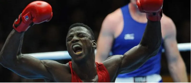 A Nigerian boxer celebrating victory in the ring