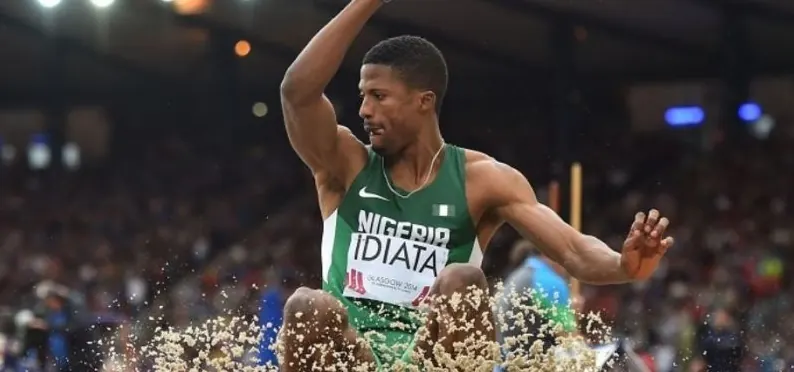 A Nigerian long jumper landing in the pit at Glasgow 2014