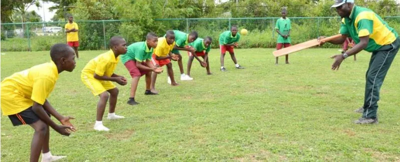 Children learning to field at a Nigerian grassroots cricket session