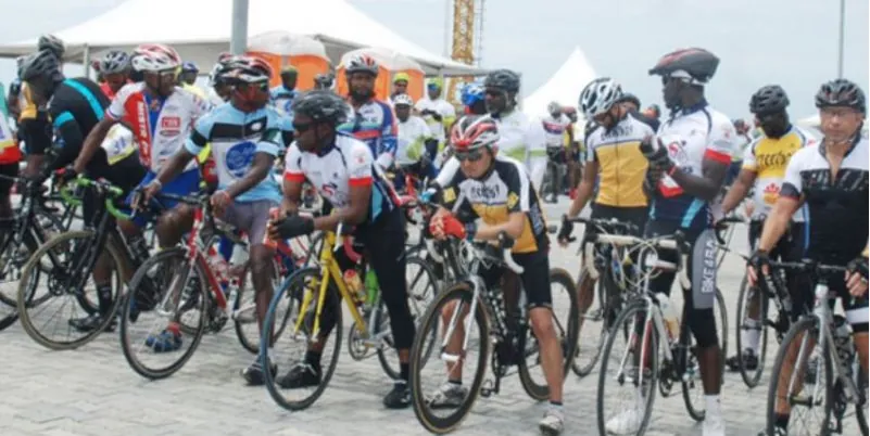 A large field of riders waiting for a race start