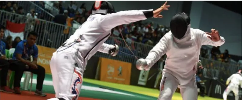 Fencers competing in an épée bout