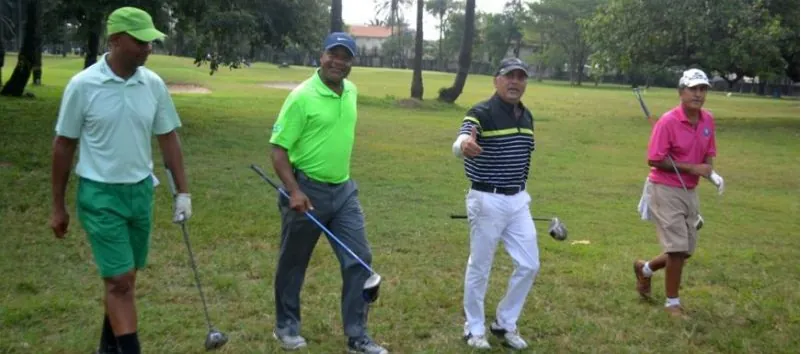 A group of Nigerian golfers walking the fairway