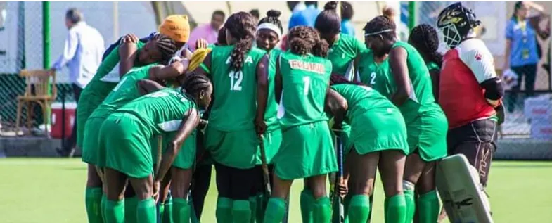 Nigeria's women's hockey players in a team huddle before a match