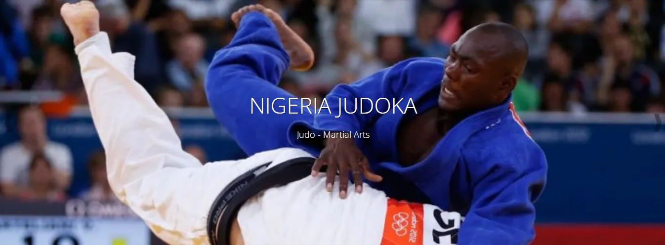A judoka throwing an opponent in blue in international competition