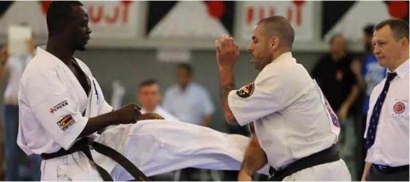 A Nigerian karateka landing a kick in competition