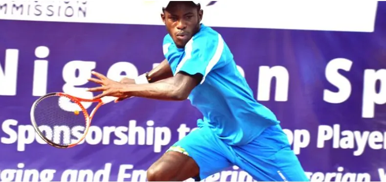 A Nigerian player hitting a running forehand at a sponsored championship