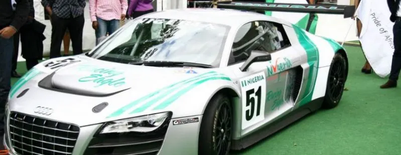 A green-and-white Nigerian-liveried Audi R8 race car on display