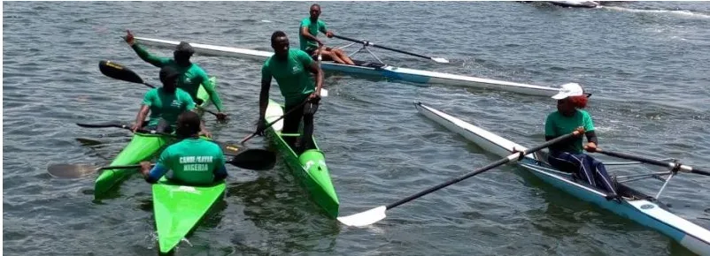 Nigerian rowers and canoeists training together on the water