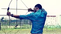Nigerian archer drawing a bow