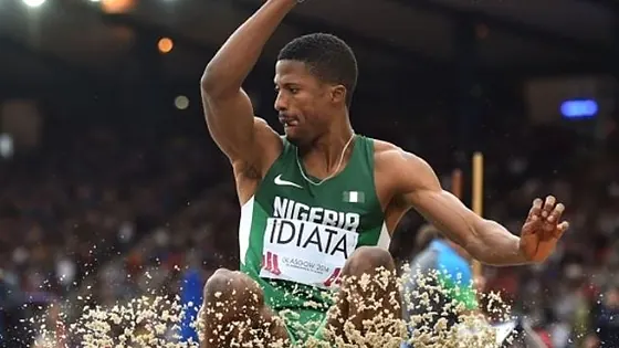 Nigerian long jumper landing in the sand pit