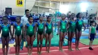 Young Nigerian gymnasts in green leotards
