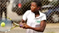 Nigerian tennis player hitting a forehand