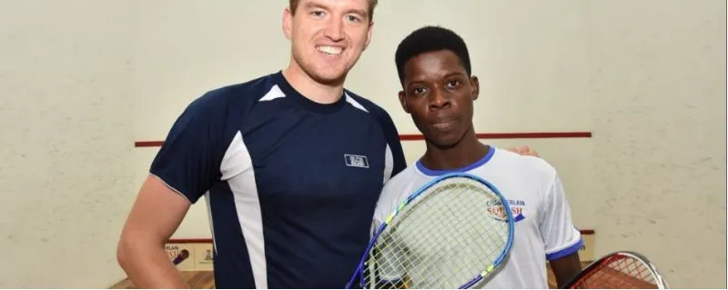 A visiting professional with a young Nigerian player