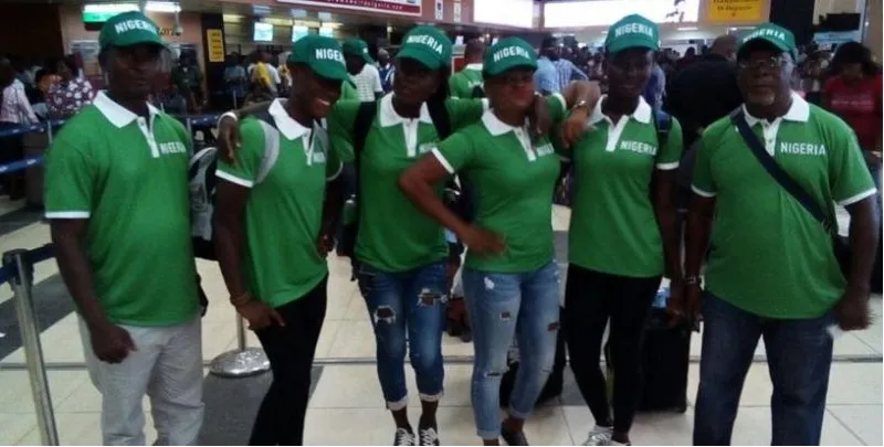 Team Nigeria swimmers in green travelling to a championship