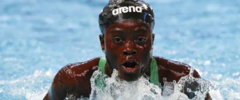 A Nigerian swimmer surfacing during a freestyle race