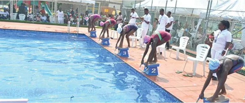 Young swimmers on the blocks at a Nigerian championship