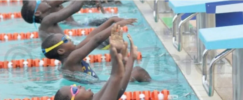 Young Nigerian swimmers starting a backstroke race